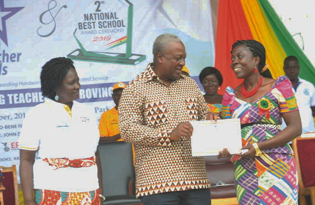   Ms Rita Oppong (right), receiving a certificate from President John Dramani Mahama, with the Minister of Education, Prof. Naana Jane Opoku-Agyemang, looking on.